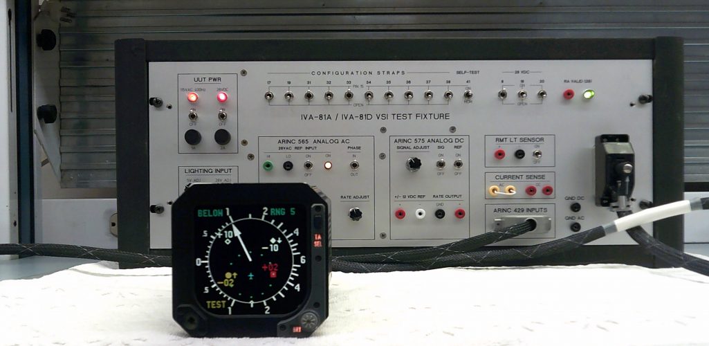 Bench testing a Honeywell IVA-81A TCAS Vertical Speed Indicator in ARINC 565 mode showing 1000 fpm increasing and TCAS intruders from ARINC 429 Simulator.